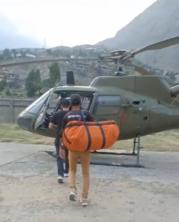 Ali Swati and Ilyas in Heli.jpg