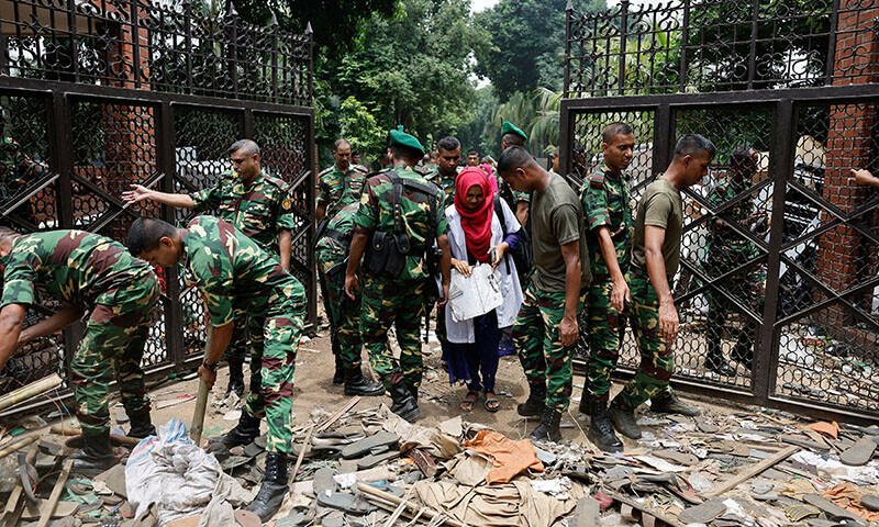 Members of the army clear an entrance of the Ganabhaban, the Bangladeshi prime minister’s residence, a day after the resignation of Prime Minister Sheikh Hasina, in Dhaka, Bangladesh, August 6, 2024. — Reuters