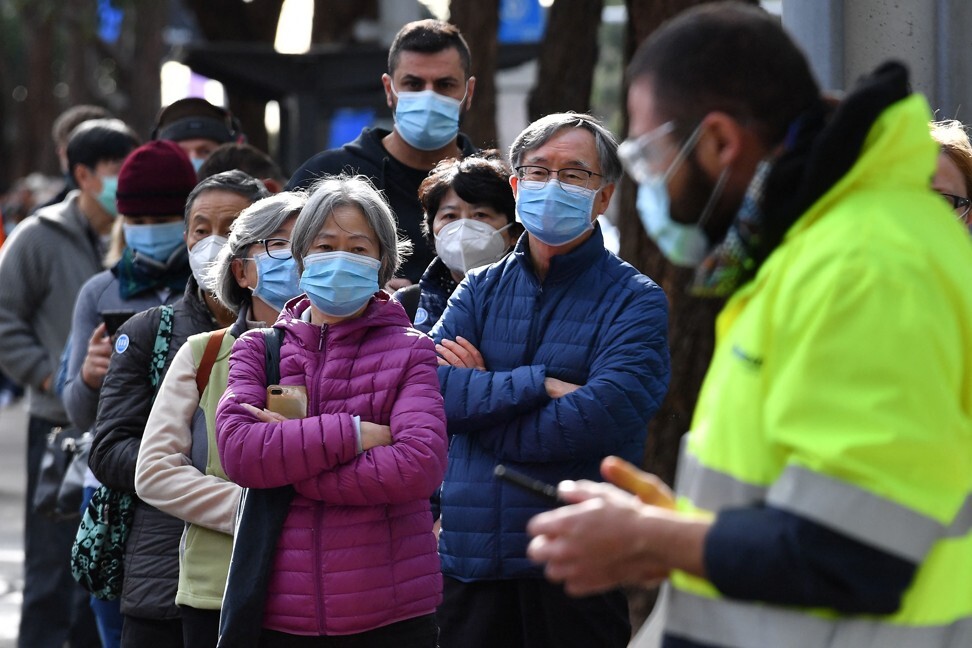 Sydney residents queue outside a Covid-19 vaccination centre. Photo: AFP