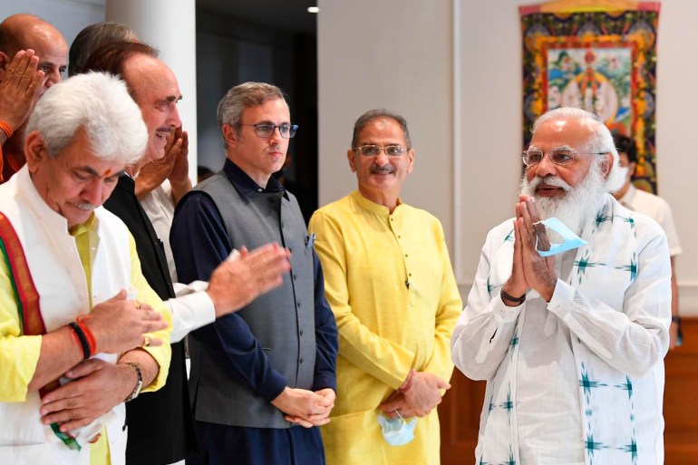 Indian Prime Minister Narendra Modi, right, greets members of various Kashmiri political parties before the start of their meeting in New Delhi, India [Prime Minister's Office/AP photo]