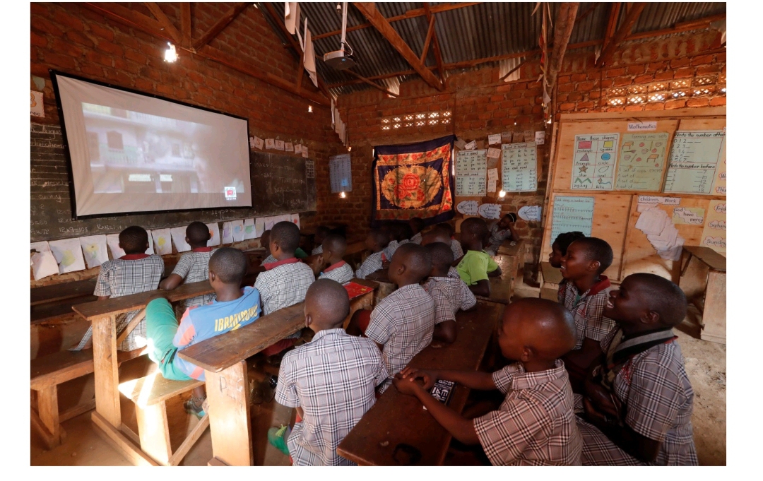 School children watching TV