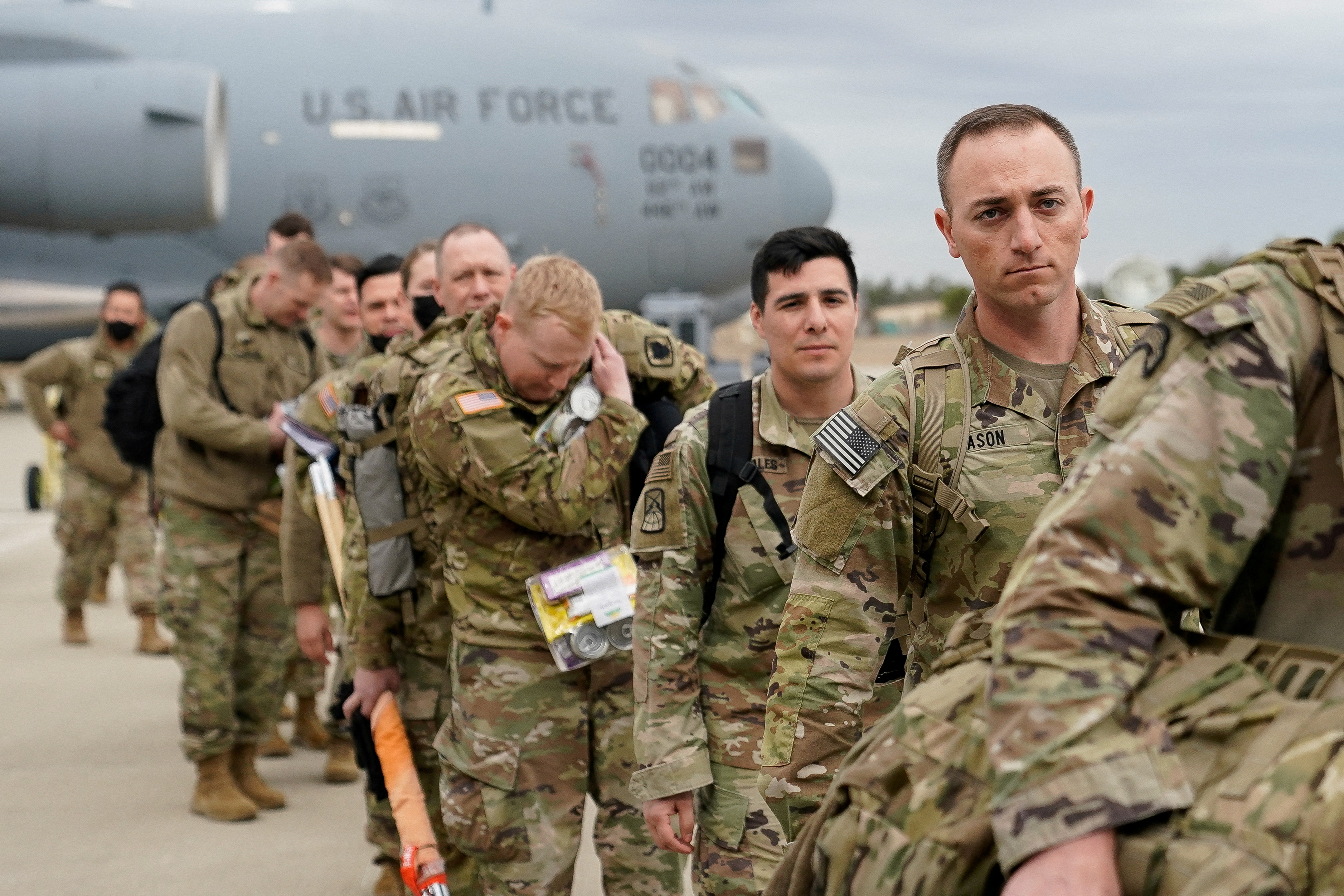 Military personnel from the 82nd Airborne Division and 18th Airborne Corps board a C-17 transport plane for deployment to Eastern Europe, amid escalating tensions between Ukraine and Russia, at Fort Bragg, North Carolina, U.S., February 3, 2022.  REUTERS/Bryan Woolston     