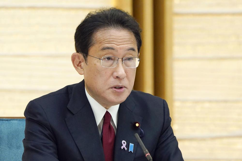 Japanese Prime Minister Fumio Kishida speaks at a meeting for the COVID-19 measures at the prime minister's office in Tokyo Friday, Nov. 12, 2021. Kishida’s government on Friday adopted a new roadmap of coronavirus measures to better prepare for a next upsurge of the infections, pledging to bolster hospital capacity, following a partial collapse of the healthcare systems in the summer that triggered massive criticisms. (Kyodo News via AP)