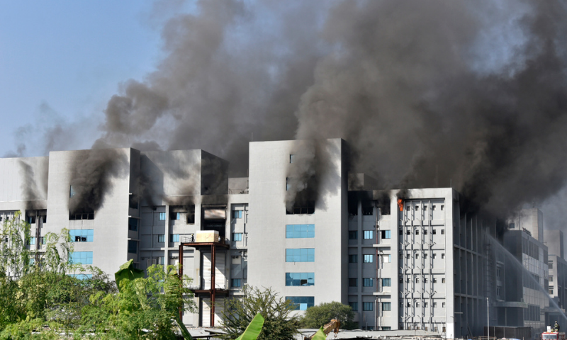 Smoke rises after a fire broke out at India's Serum Institute in Pune on Thursday. — AFP