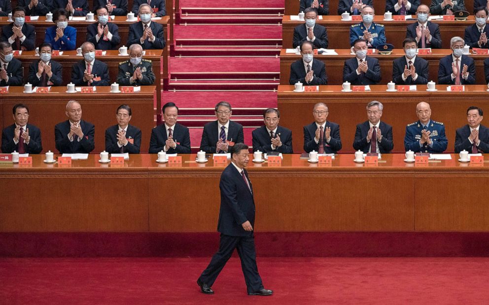 PHOTO: Chinese President Xi Jinping is applauded by senior members of the government and delegates as he walks to the podium before his speech at the 20th National Congress of the Communist Party of China, Oct. 16, 2022 in Beijing.