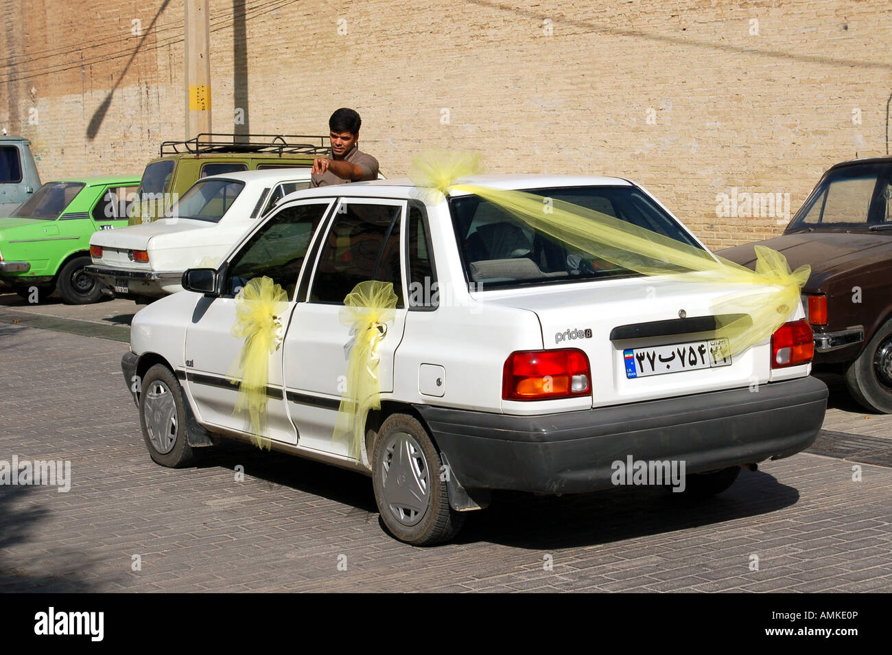 kia-pride-car-prepared-for-a-wedding-tehran-iran-AMKE0P.jpg