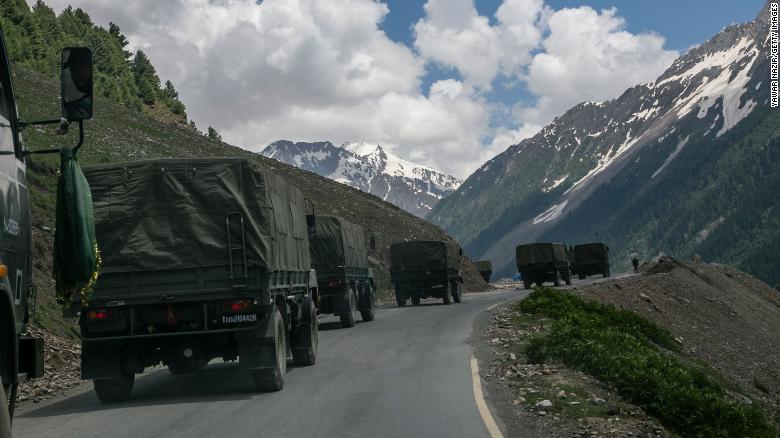 An Indian army convoy travels through Zoji La, a high mountain pass bordering China on June 13 in Ladakh, India.