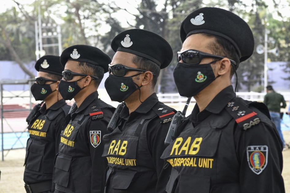 Bangladeshi RAB (Rapid Action Battalion) Dog squad unit stand on guard at the Central Shaheed Minar in Dhaka, Bangladesh. 