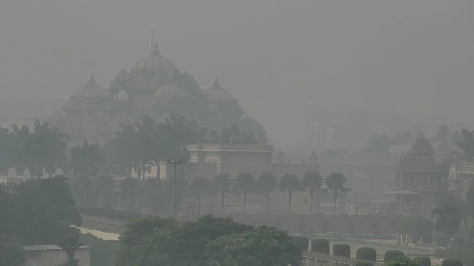 The Akshardham temple is barely visible as smog envelopes New Delhi on November 9, 2023. - Arun Sankar/AFP/Getty Images