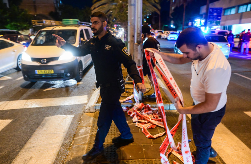  Police at the scene where a man killed after being stabbed during a road rage incident in Holon, on November 23, 2022 (credit: AVSHALOM SASSONI/FLASH90)