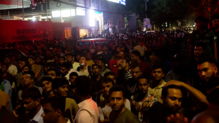 People crowd in front of the Khawaja Tower at Mohakhali after a fire broke out in the building on 26 October 2023. Photo: Nayem Ali/ TBS