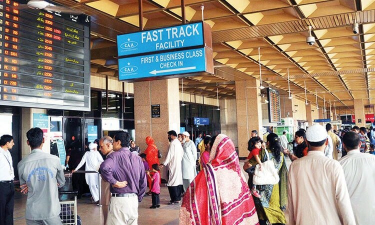 Citizens are seen at the Jinnah International Airport in Karachi. — AFP/File