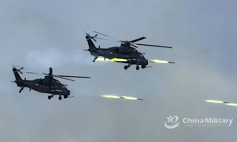 An armed helicopter fleet launches an assault on the defense works and firing points of the mock terrorists during the low-altitude defense penetration operations in the China-Russia joint military exercise ZAPAD/INTERACTION-2021 at a training base of the PLA Army in Qingtongxia City of West China's Ningxia Hui Autonomous Region from August 9 to 13, 2021. (eng.chinamil.com.cn/Photo by Wang Weidong)