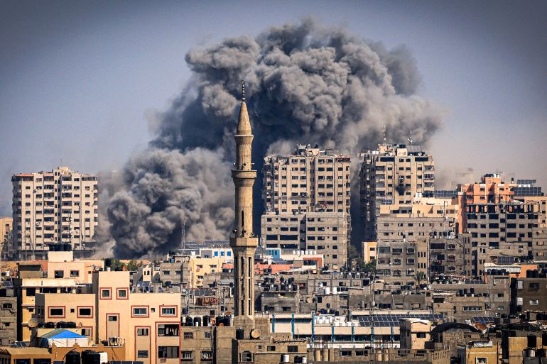 Smoke plumes billow during Israeli air strikes in Gaza City on October 12, 2023 as raging battles between Israel and the Hamas movement continue for the sixth consecutive day. - Thousands of people, both Israeli and Palestinians have died since October 7, 2023, after Palestinian Hamas militants based in the Gaza Strip, entered southern Israel in a surprise attack leading Israel to declare war on Hamas in Gaza on October 8. (Photo by MAHMUD HAMS / AFP)