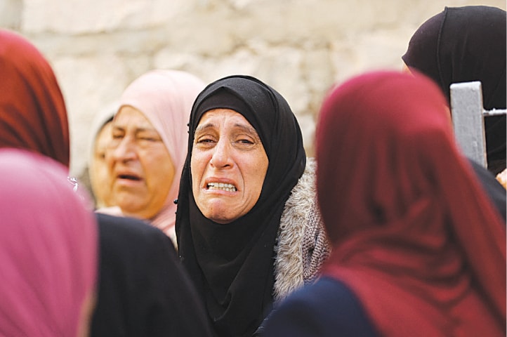 A WOMAN reacts during funeral of Palestinian Daoud Rayan who was killed by Israeli forces in Bayt Duqu, occupied West Bank, on Thursday.—Reuters