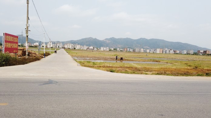 Like everywhere in China, a sealed road in Guangxi leads into the village