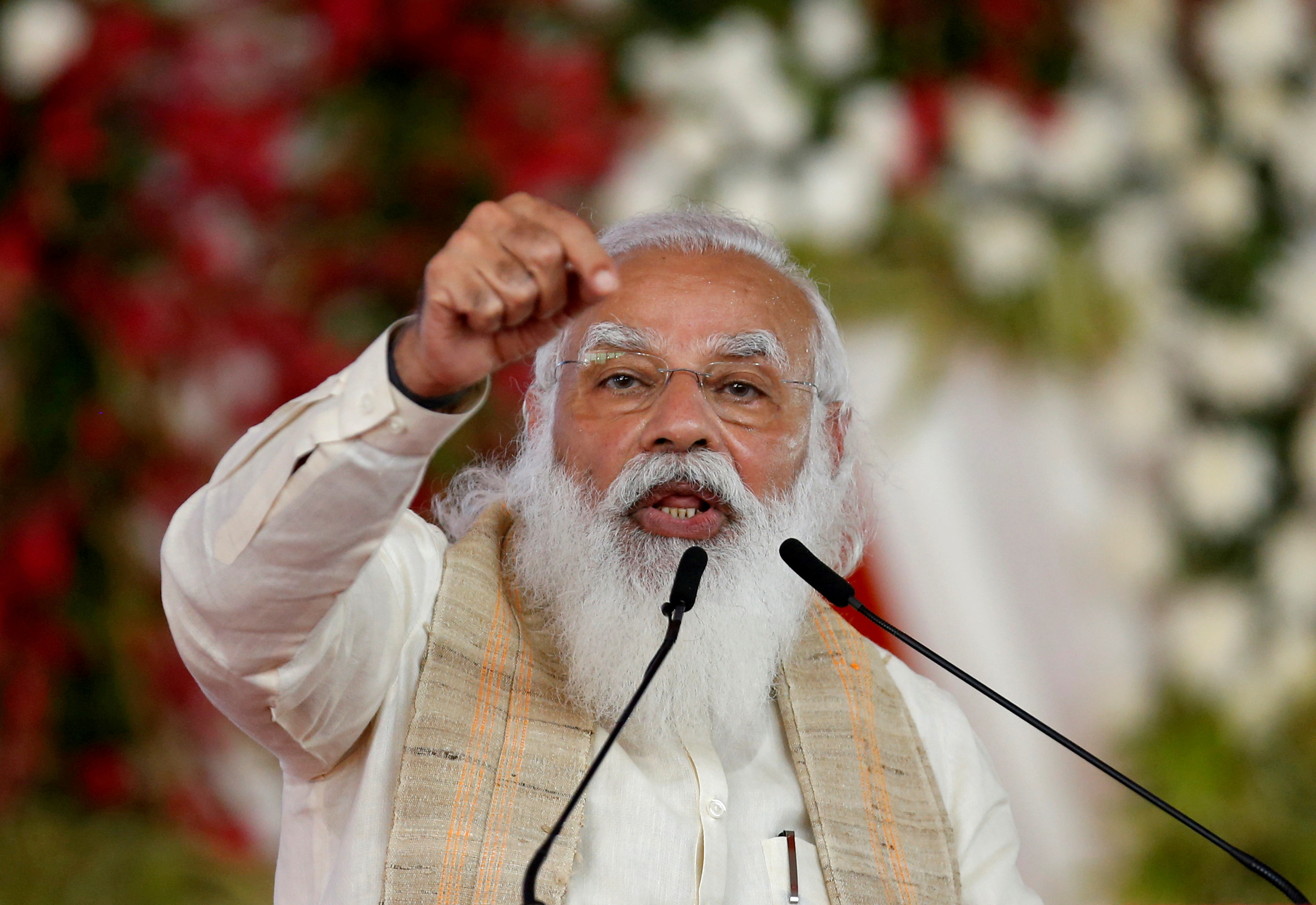 India's Prime Minister Narendra Modi addresses a gathering before flagging off the Dandi March, or Salt March, to celebrate the 75th anniversary of India's Independence, in Ahmedabad, India, March 12, 2021. REUTERS/Amit Dave