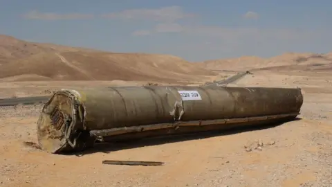 EPA The wreckage of an Iranian ballistic missile outside the city of Arad, southern Israel, 02 October 2024