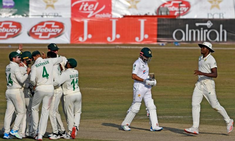 South Africa's players celebrate after the dismissal of Pakistan's captain Babar Azam (C) during the third day of the second Test cricket match between Pakistan and South Africa at the Rawalpindi Cricket Stadium on Saturday. — AFP