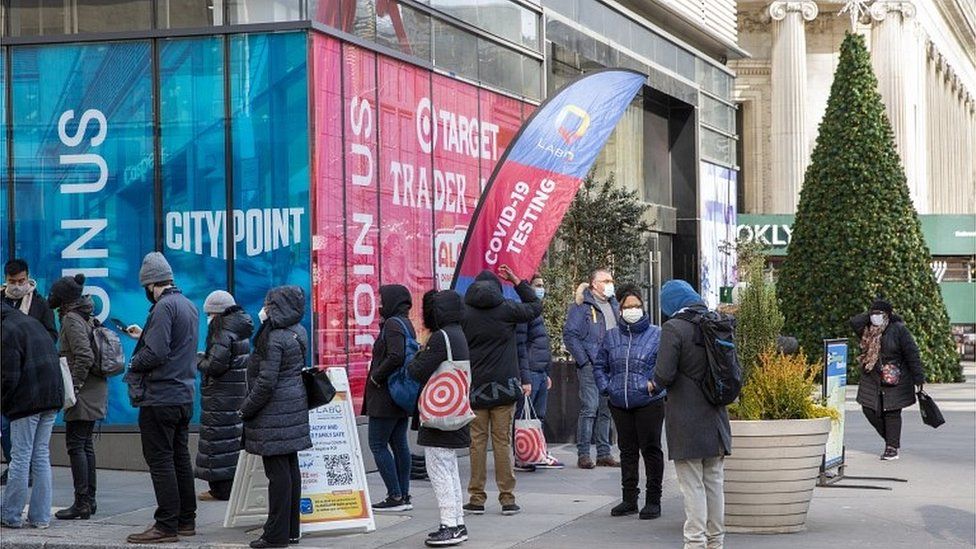 People wait in line to take a COVID-19 test at Albee Square in New York, New York, USA, 23 December 2021