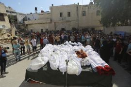 Relatives attend the funeral of Palestinians who were killed in Israeli airstrikes that hit a church, in Gaza City [Abed Khaled/AP Photo]