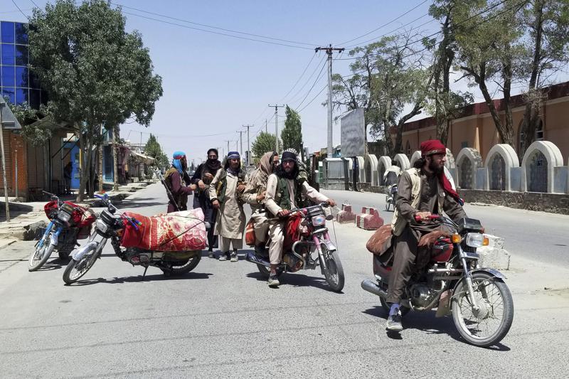 Taliban fighters patrol inside the city of Ghazni, southwest of Kabul, Afghanistan, Thursday, Aug. 12, 2021. The Taliban captured the provincial capital near Kabul on Thursday, the 10th the insurgents have taken over a weeklong blitz across Afghanistan as the U.S. and NATO prepare to withdraw entirely from the country after decades of war. (AP Photo/Gulabuddin Amiri)