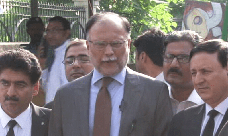 Planning Minister Ahsan Iqbal talks to the media in Islamabad. — DawnNewsTV/File