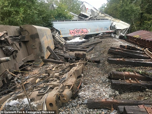 The CSX train with about 170 cars, including three locomotives, ran off the tracks in Lilburn, according to Gwinnett County Fire and Emergency Services