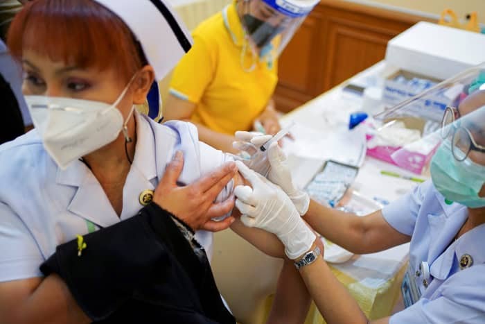 A Thai health worker receiving the Sinovac vaccine.