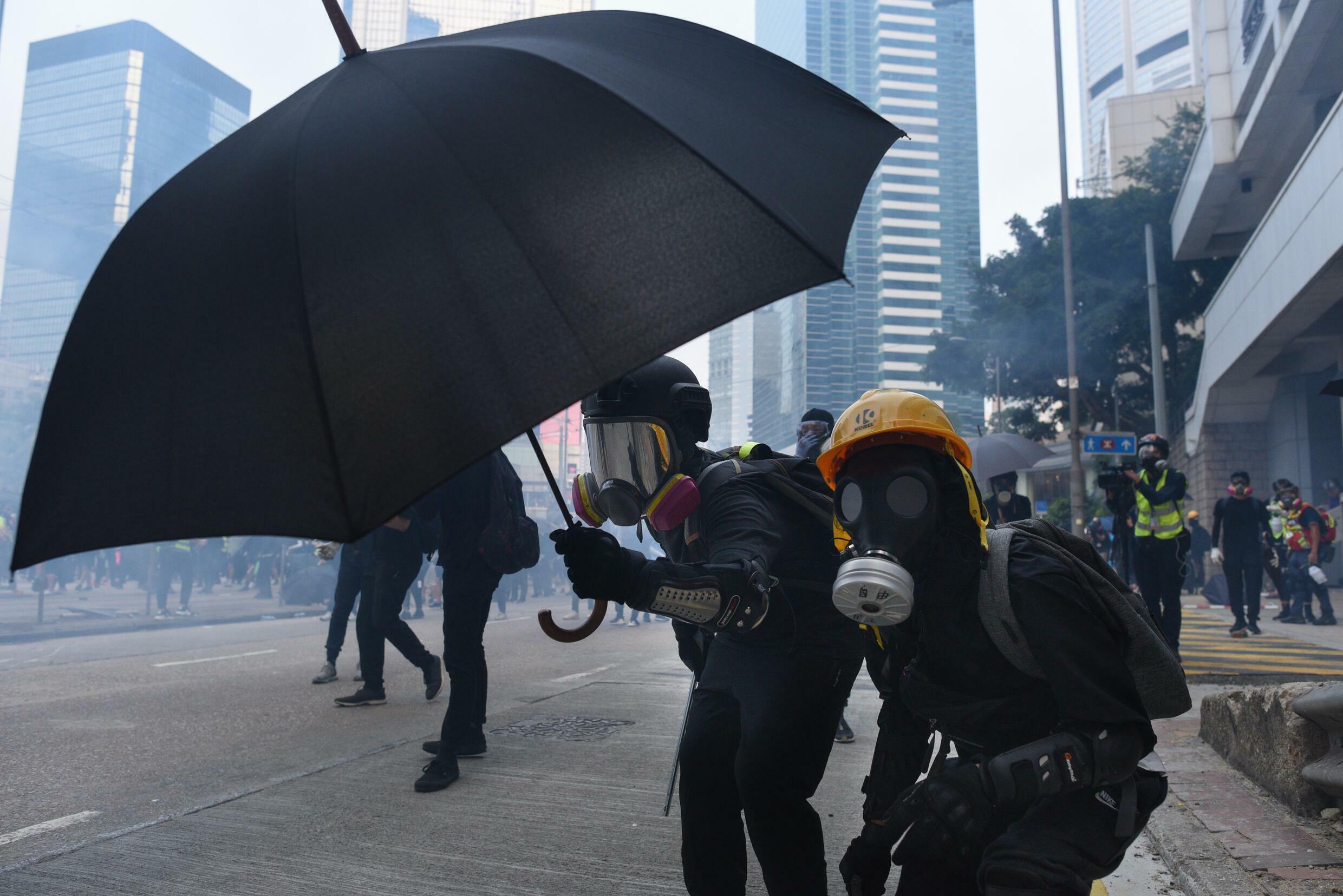 Protesters use an umbrella as a shield during the turmoil in Hong Kong in September 2019.