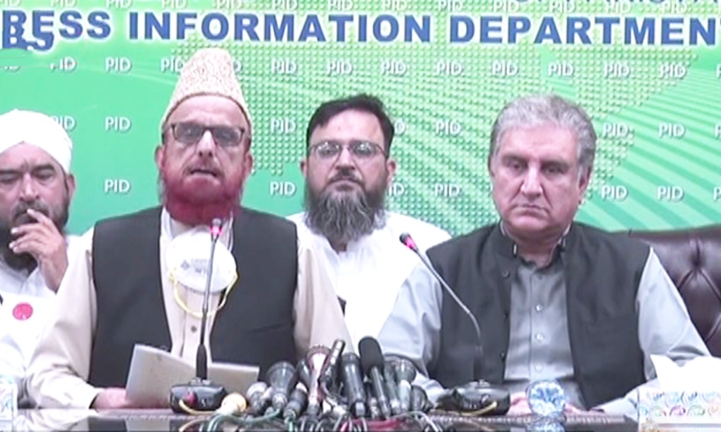 Mufti Muneebur Rehman and Foreign Minister Shah Mahmood Qureshi address a press conference in Islamabad on Sunday. — Photo: DawnNewsTV