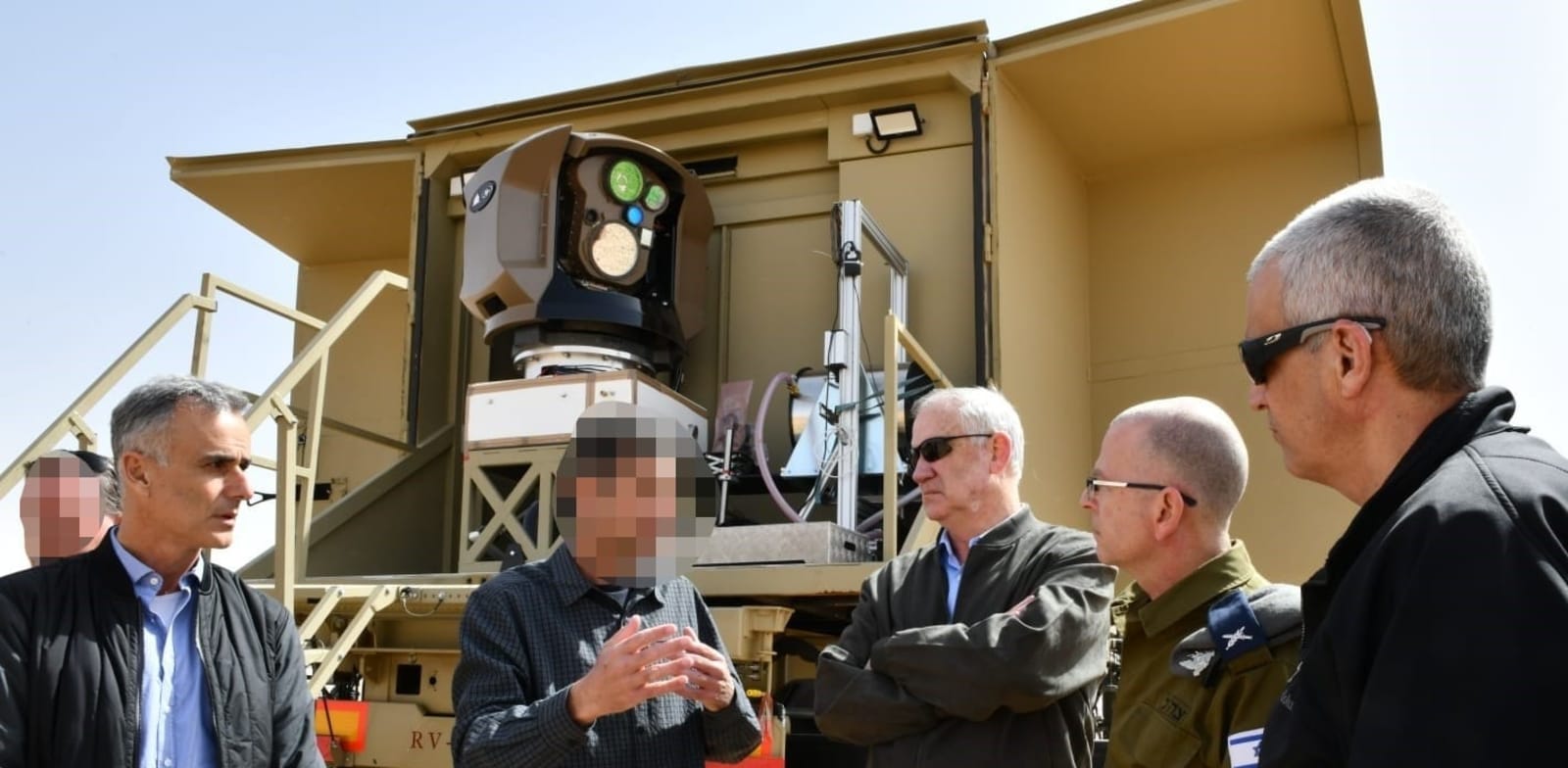 Defense Minister Benny Gantz with Rafael's laser system  credit: Ministry of Defense