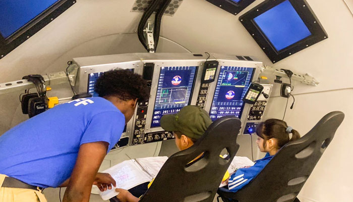 An official is guiding students at the Space Camp in Huntsville. — US Consulate General Karachi