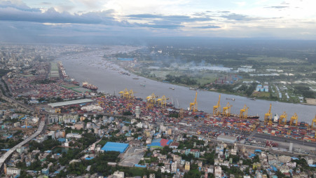 Ctg Port Gets A Boost: The Chattogram port officially starts to berth vessels with 10 metres drought on Monday. As of now, only 9.5m draught vessels could anchor at the port, each carrying 2,500 TEUs. But the 10m draught ship will be able to carry 4,000 TEUs, bumping up the port’s container handling capacity and bringing down costs. The photo was taken recently from the port area. Photo: Mohammed Minhaj Uddin