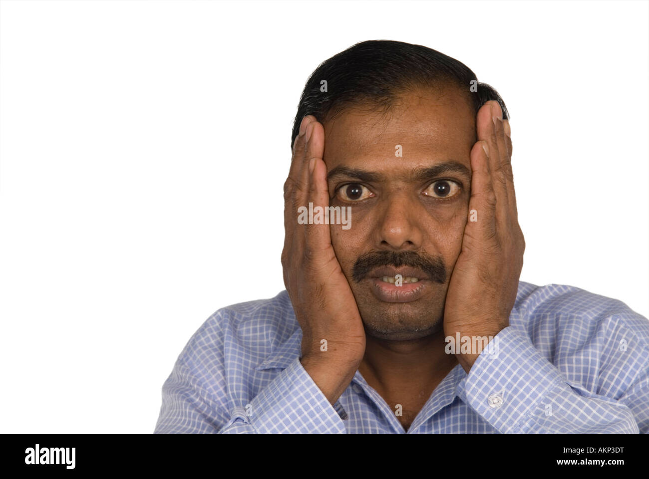 shocked-mature-indian-man-hands-on-head-AKP3DT.jpg