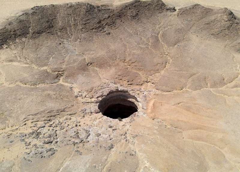 An aerial picture shows the Well of Barhout—known as the "Well of Hell"—in the desert of Yemen's Al-Mahra province